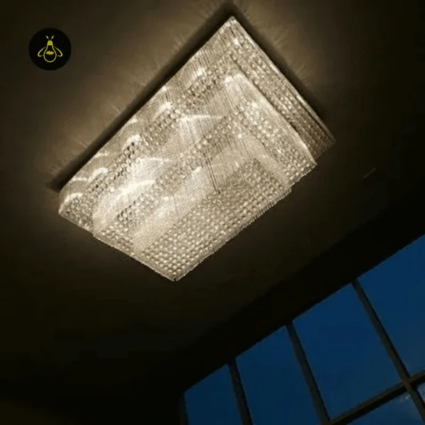 Crystal flush mount chandelier radiating sparkling light in a hotel interior