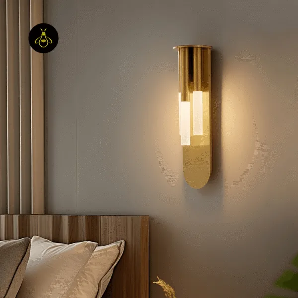 Glass wall lamp lit on a bedroom wall next to a wooden slatted headboard