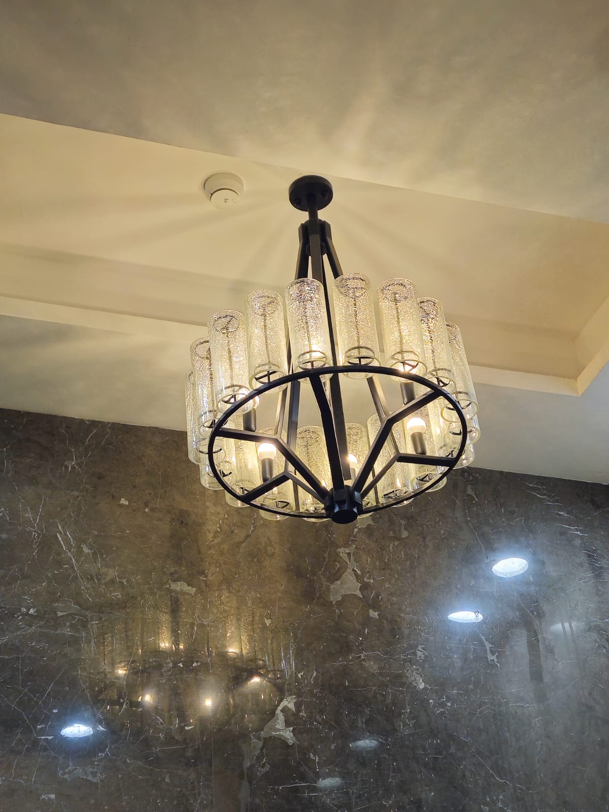 Commercial restroom chandelier installation at Ace Capitol