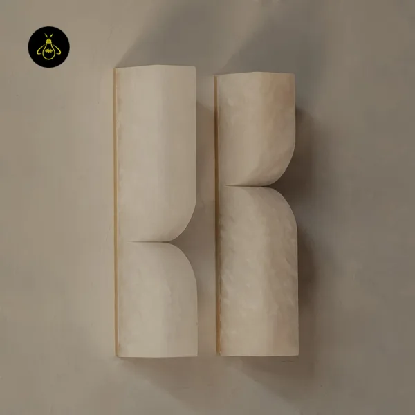 Two unlit alabaster wall lights showing the pinched waist and 6.5 cm projection