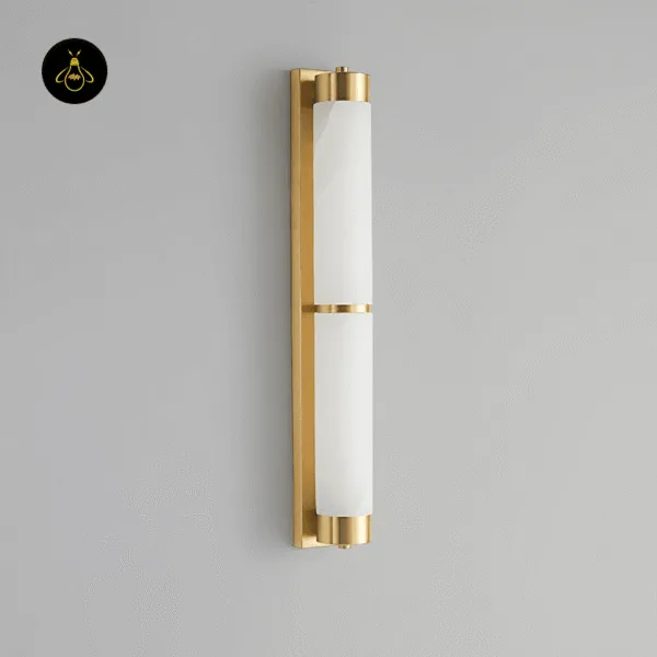 Alabaster wall light switched off, side angle showing the brushed gold backplate, end caps and centre band