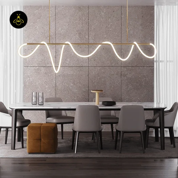 Sleek gold stainless steel bar element of the linear LED chandelier
