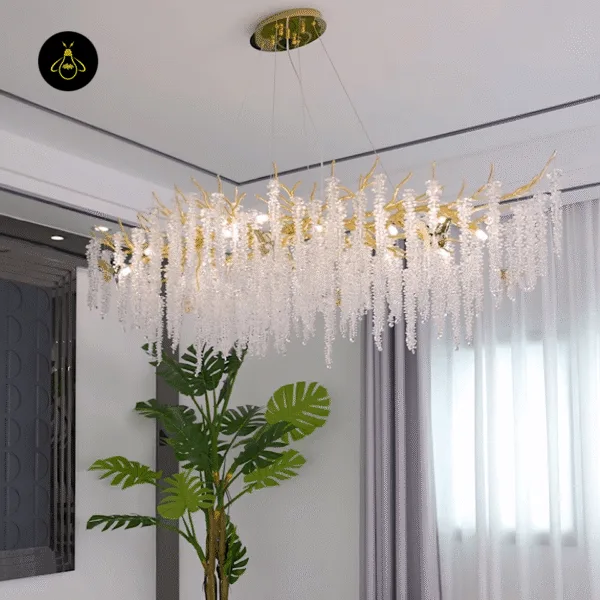 Linear wisteria crystal chandelier in a living room with warm G9 lamps and crystal sparkle