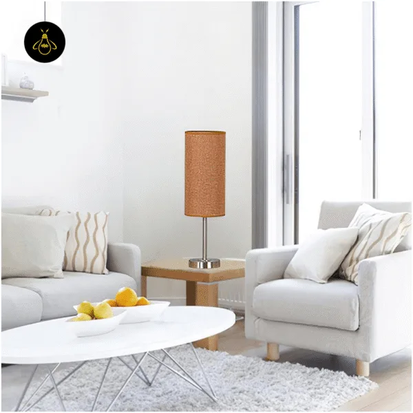 Linen fabric table lamp styled on a side table in a modern living room