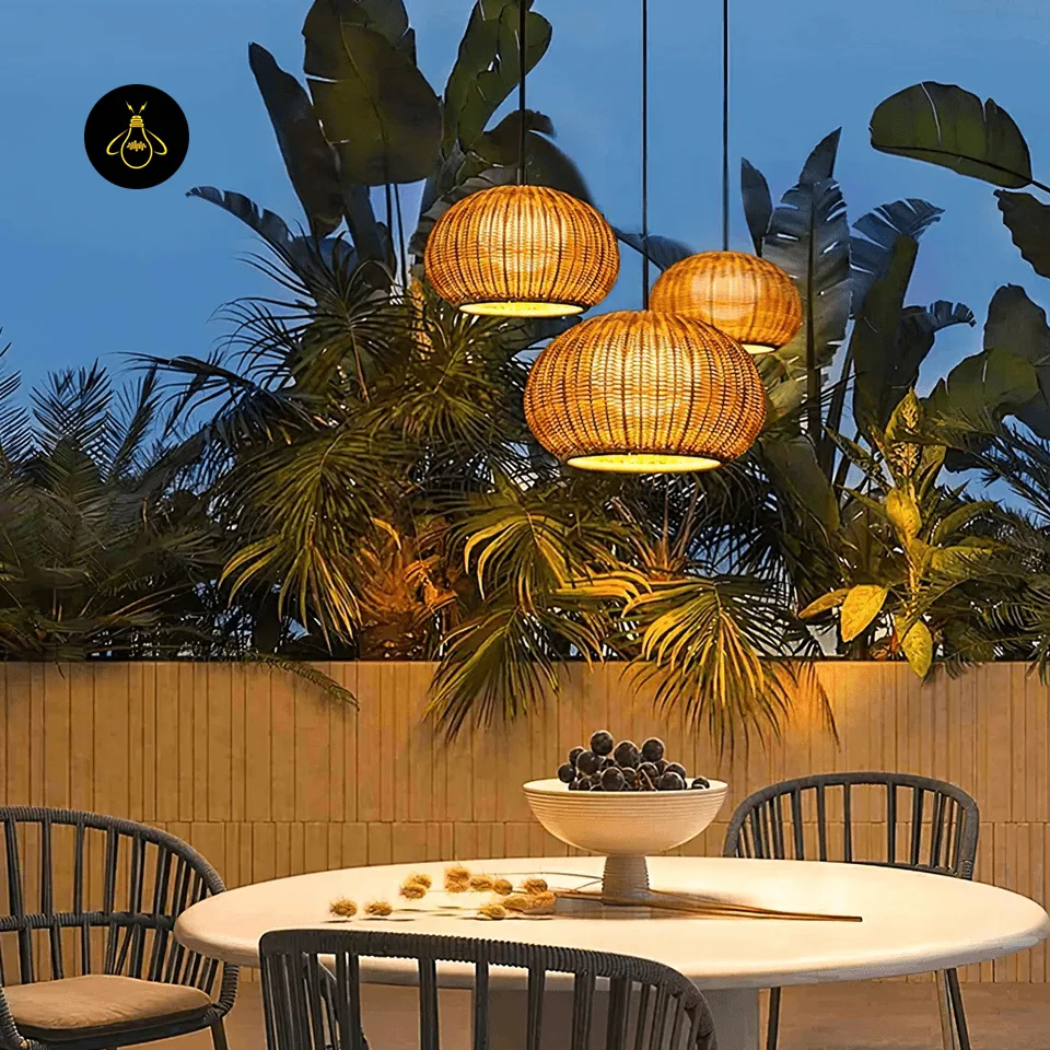 Bamboo Hanging Light – 60 cm Woven Dome Pendant for Kitchen & Dining 6 Three woven bamboo hanging lights over a covered patio dining table at dusk