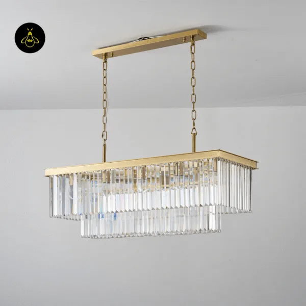 Crystal chandelier in satin gold lighting a grand entrance