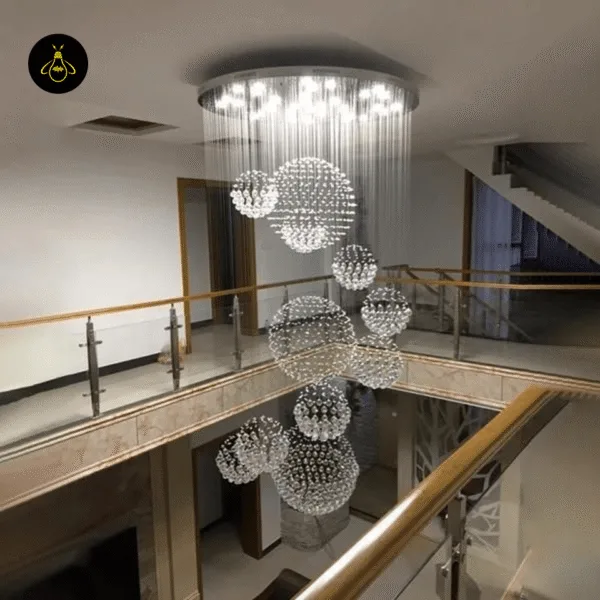Long spiral raindrop chandelier in a hotel lobby stairwell