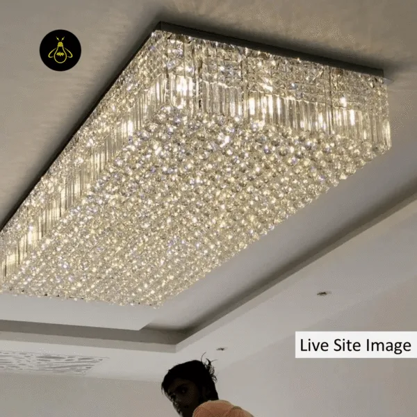 Raindrop crystal flush mount chandelier installed over a dining room table