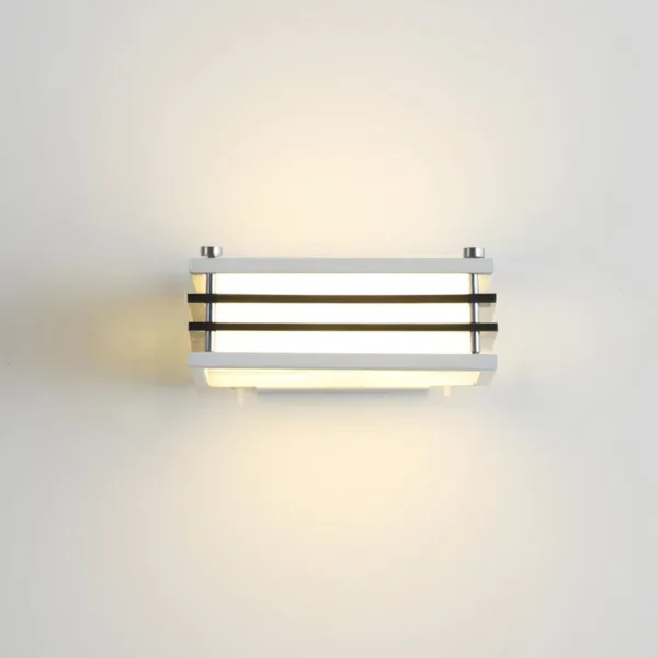 Wall sconces for bedroom: white Toast wall light from the front, warm 3000K glow spreading up and down a cream wall