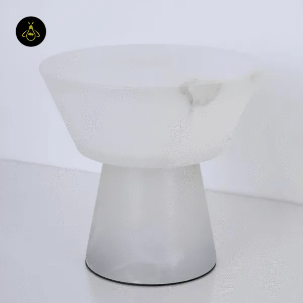 Alabaster mushroom table lamp unlit, white stone bowl and tapered stem