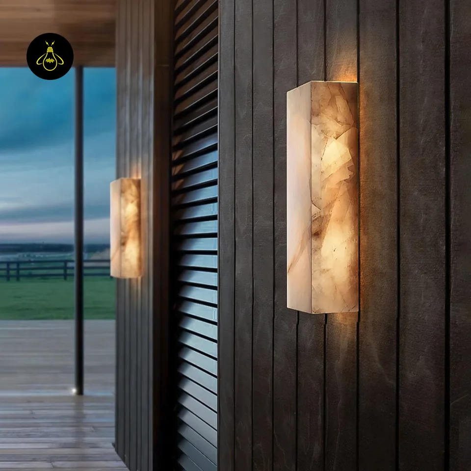 Alabaster Outdoor Wall Light – 65 cm IP65 Stone Sconce 8 Alabaster outdoor wall light glowing warm on a dark textured exterior wall at night