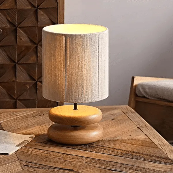 Warm textured glow from the wabi sabi table lamp through its hemp rope shade