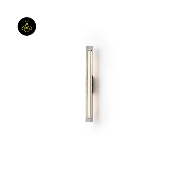 Fluted glass wall lamp side view on white, slim 5 cm tube lit warm white