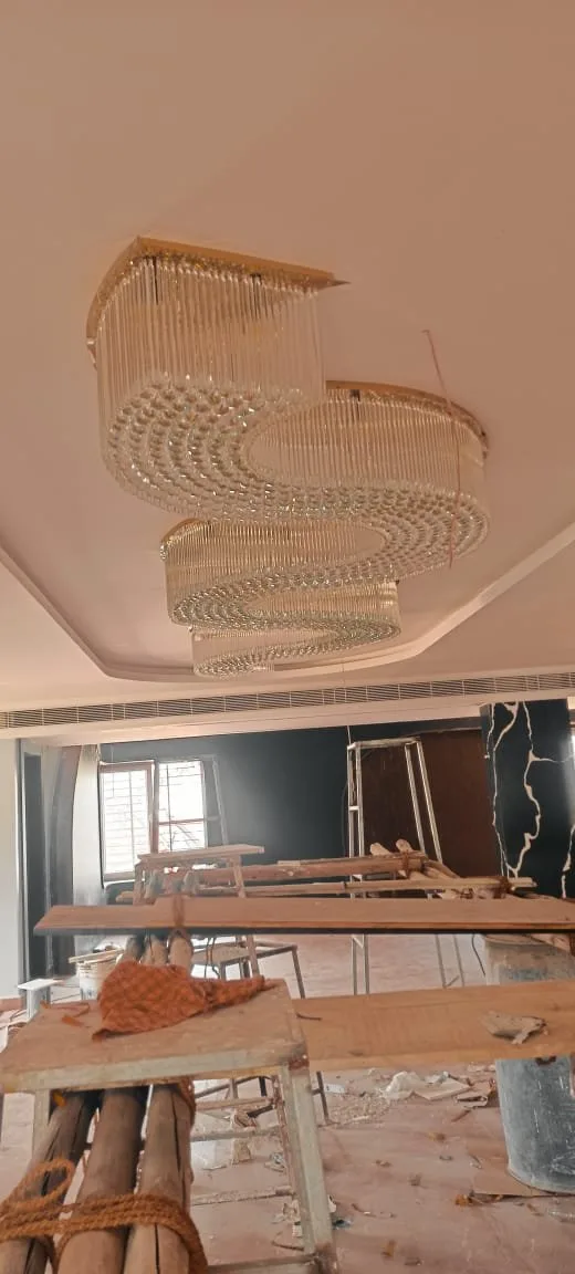 Banquet chandelier Visakhapatnam crystal wave glowing across the hall ceiling