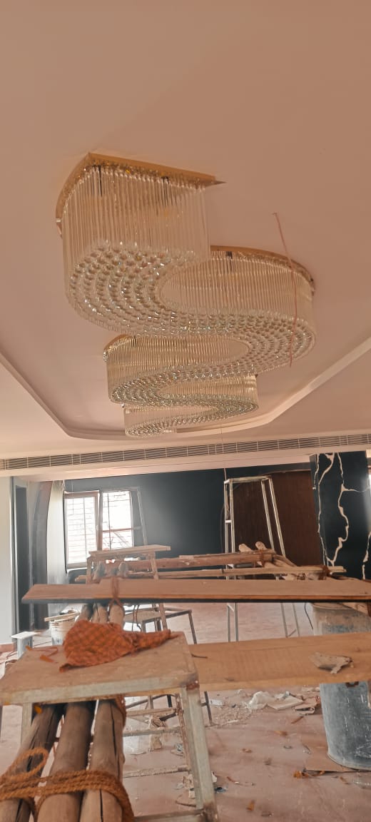 Warm white crystal chandelier lighting in the Visakhapatnam banquet project