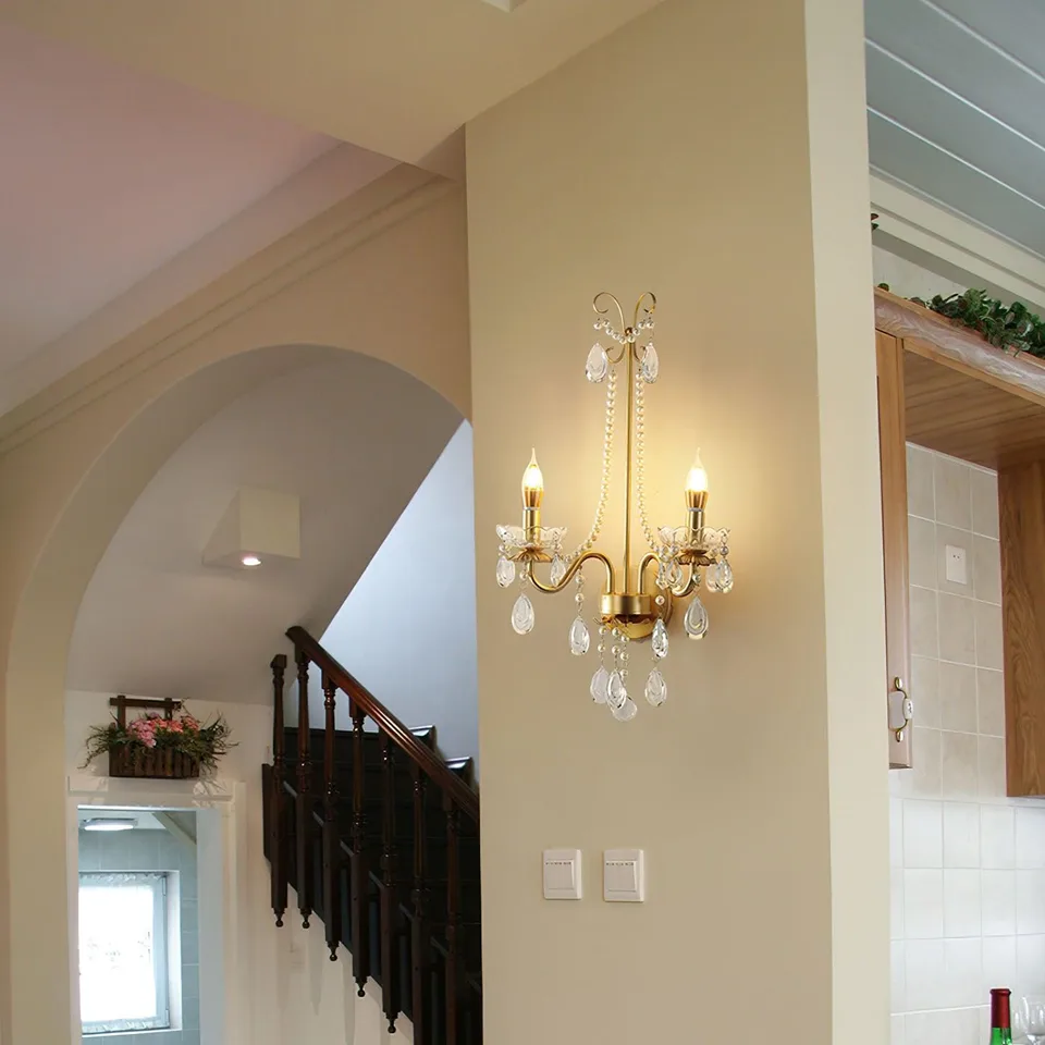 Gold Crystal Wall Sconce – 2-Light Pearl Chain French Sconce, 64 cm 8 Two-light gold crystal wall sconce beside a staircase with warm ambient light