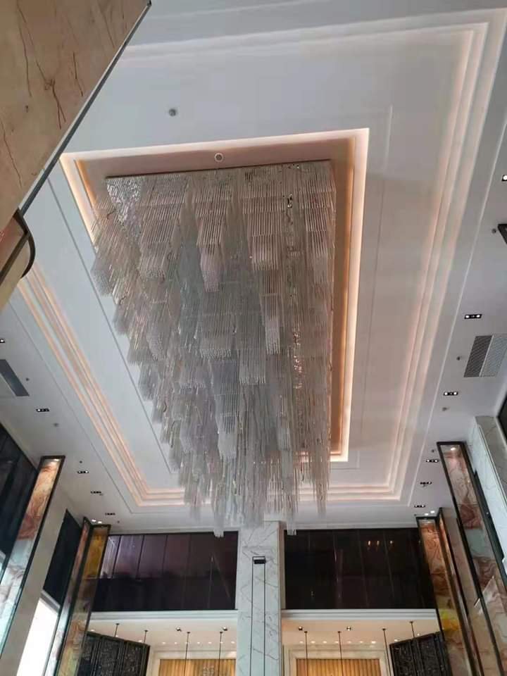 Large recessed waterfall crystal chandelier installed at Chateau Royale Hotel and Banquet Nagpur