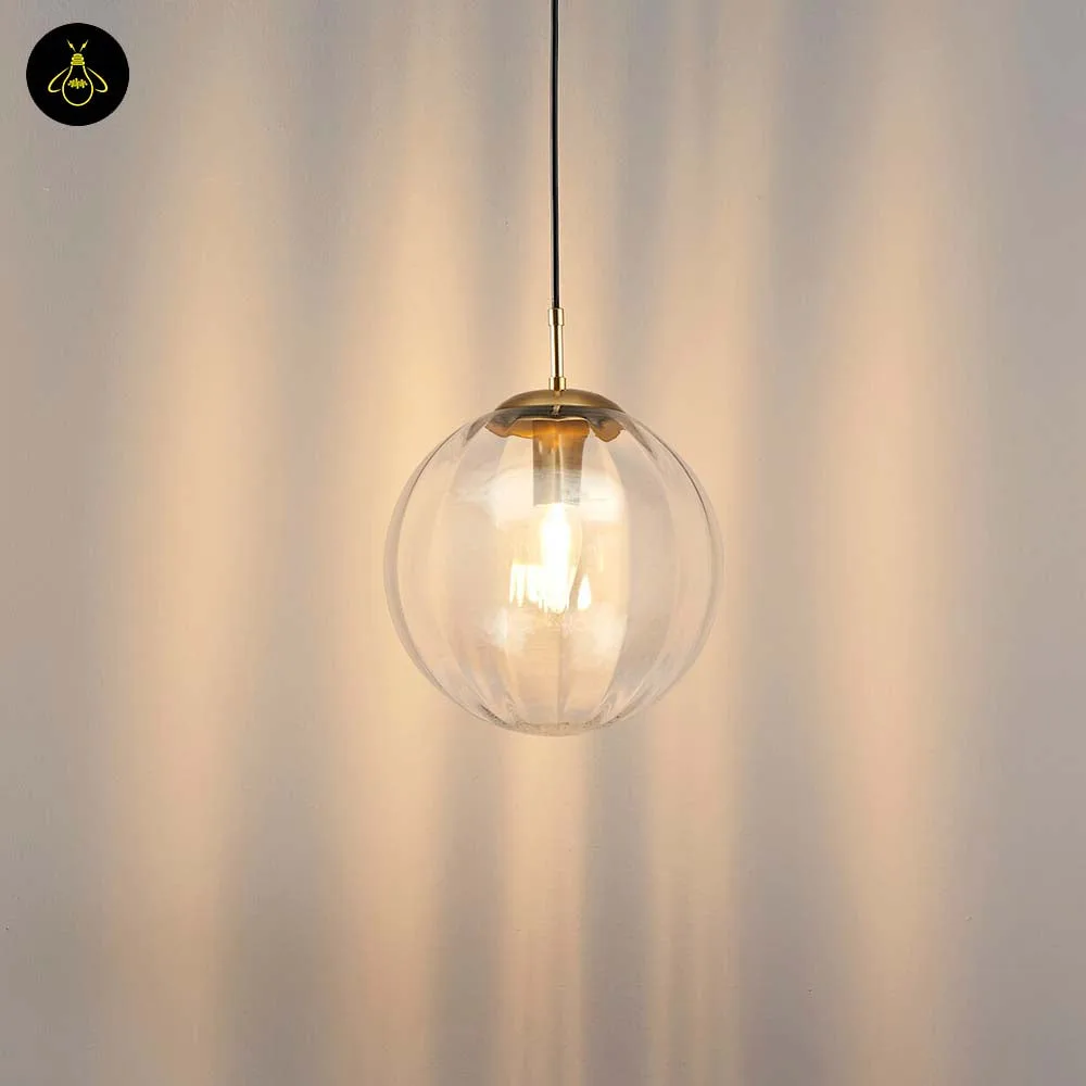 Ribbed glass ball pendant light with adjustable cable suspension – front view