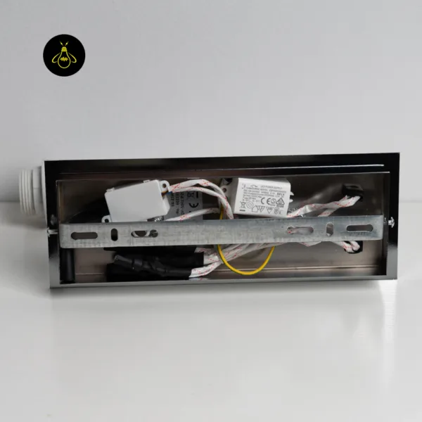 Inside the chrome stainless steel backplate of the wall mounted bedside light: LED driver, wiring and mounting bracket