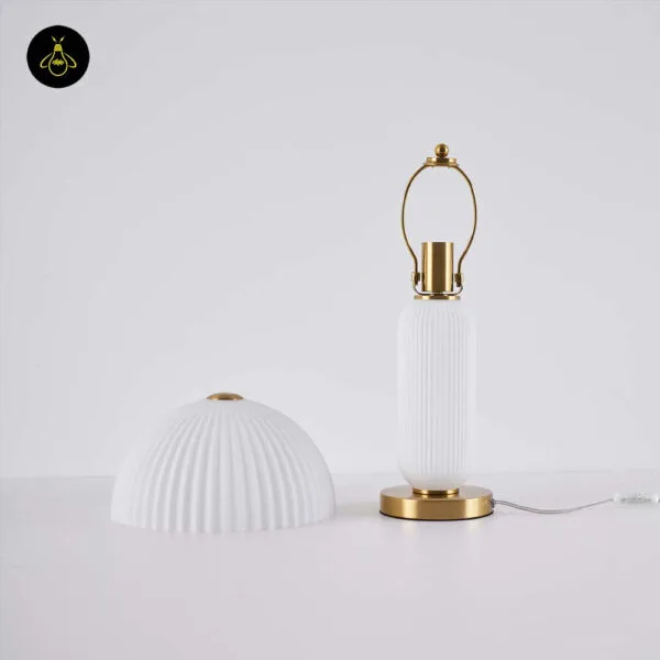 Fluted glass mushroom lamp shade and brass-harp body shown separately