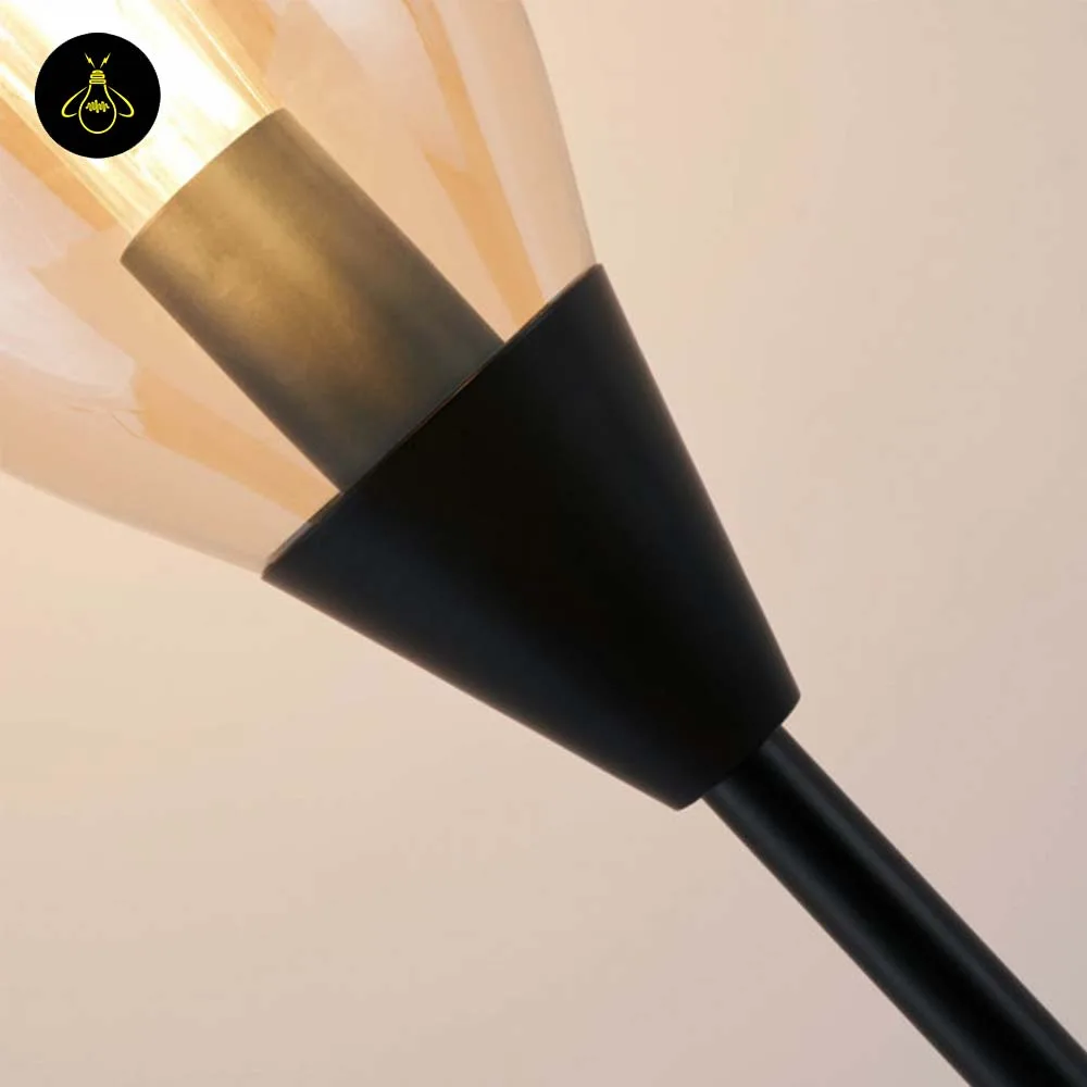 Black Amber Glass Floor Lamp – Modern Teardrop Shade | Ambrosia 8 Black amber glass floor lamp giving ambient light in a dining area