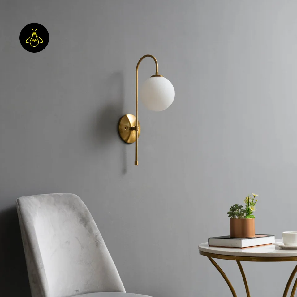 Oriol Frosted Glass Globe Wall Sconce – 48 cm Antique Gold Arch | Jagmag Lights 3 Gold-lustre borosilicate glass wall light casting a warm diffused glow for living room walls