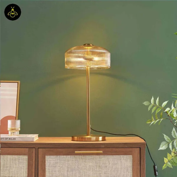 Ribbed amber glass table lamp on a bedside table, vintage Aureline design