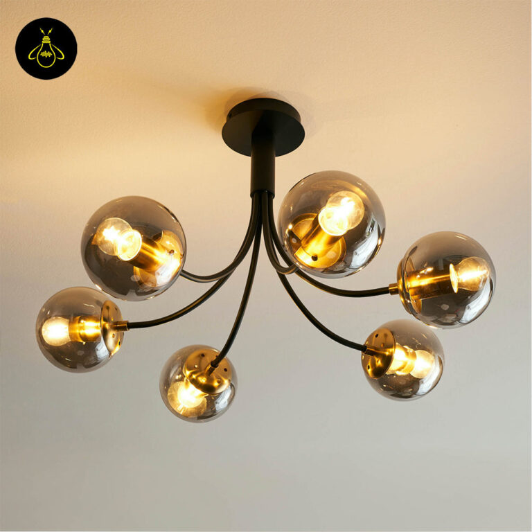 Modern black glass ball chandelier giving warm ambient light in a stylish bedroom