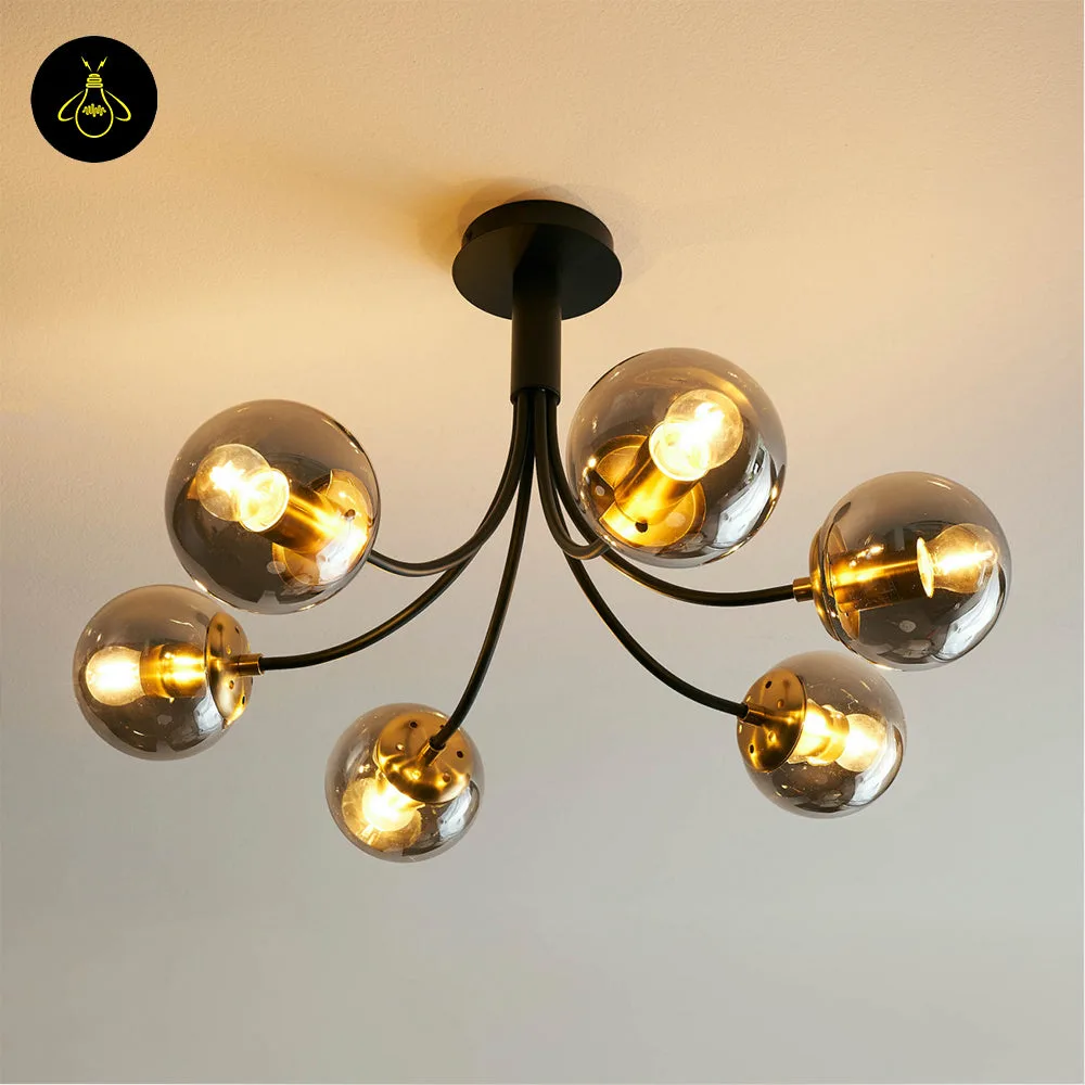 Black Glass Chandelier – 6-Light Smoke Glass Globe Semi-Flush 3 Modern black glass ball chandelier giving warm ambient light in a stylish bedroom