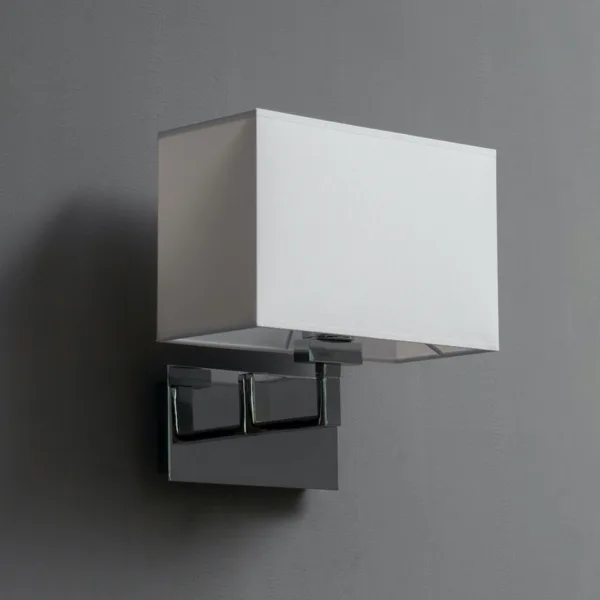 Wall lamp with shade, unlit: white rectangular fabric shade on a polished chrome stainless steel arm, grey wall