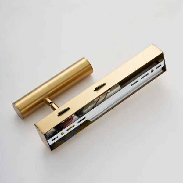 Satin gold wall reading lamp with the backplate open, showing the wiring and mounting bracket
