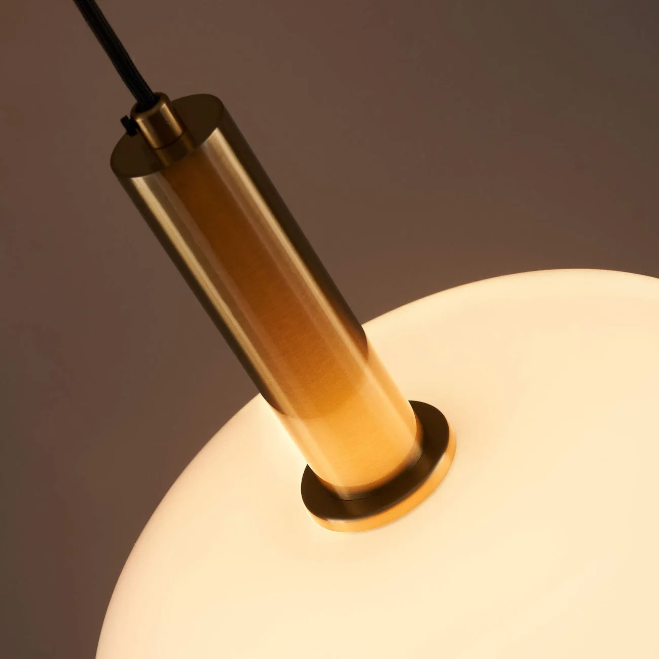 Opaline Glass Pendant Light – Round Brass-Finish Design 7 Brass-finish opaline glass pendant light glowing soft warm white