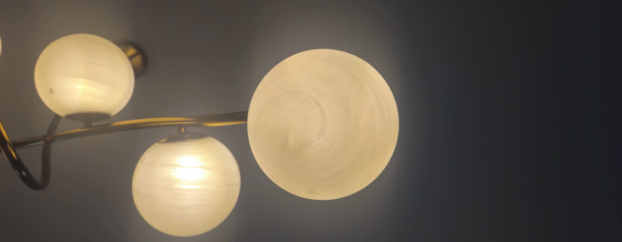 Double Height LED Chandelier: 5 Bold Ideas From SKA Destiny One 3 Brass-tone LED chandelier with acrylic rings used in SKA Destiny One