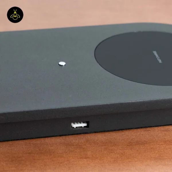 USB-A port and Qi wireless charging pad on the matte black LED table lamp base
