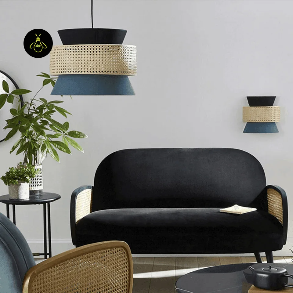 Cane & Fabric Layered Drum Pendant Light – 45 cm 9 Teal and black cane hanging light in a living room above a black velvet sofa, with a plant and cane chair