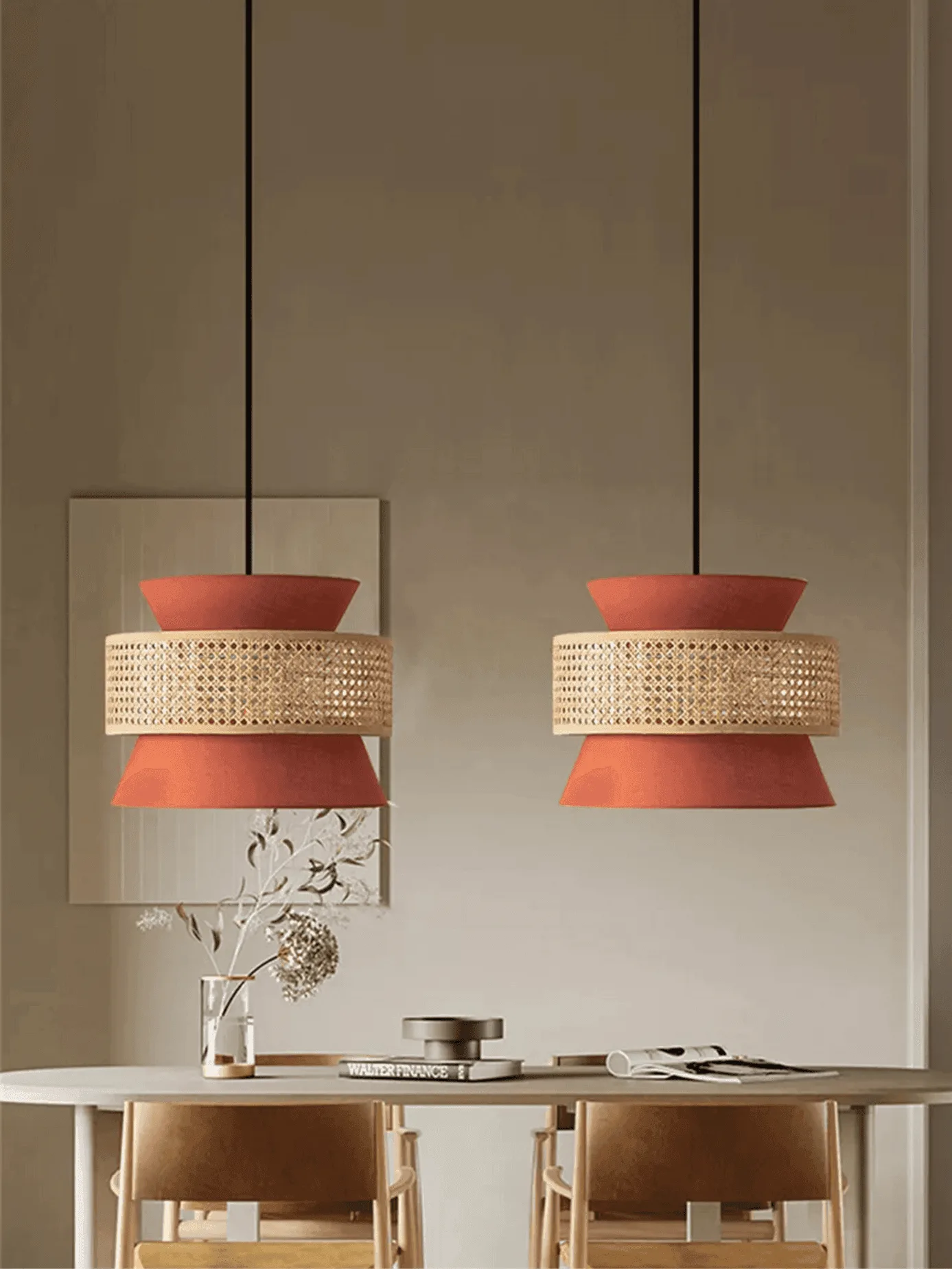 Cane & Fabric Layered Drum Pendant Light – 45 cm 4 A pair of terracotta cane hanging lights on black cords over a round dining table with wooden chairs