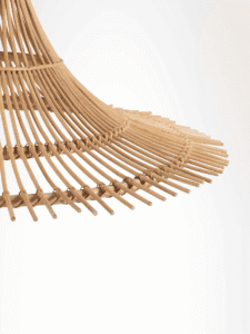 Cane-style bamboo pendant light hanging over a dining space