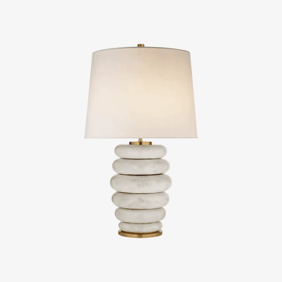 Ceramic table lamp with six stacked off-white glazed rings, a brass-finish base and a white linen drum shade
