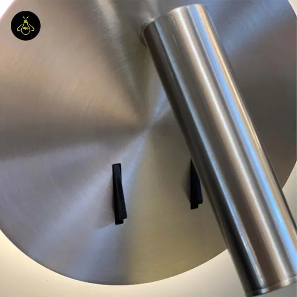 Detail of the wall lamp for bedroom: brushed 304 stainless steel reading spot over the disc and black toggle switches