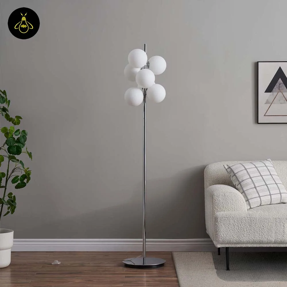 Chrome Floor Lamp with 7 White Glass Spheres – 161 cm 3 Chrome glass-sphere floor lamp in a bedroom setting