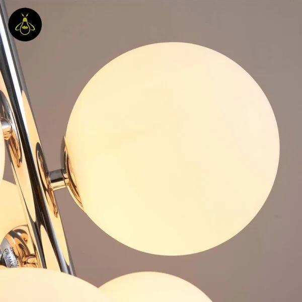 Chrome white-glass-sphere floor lamp in a hotel interior