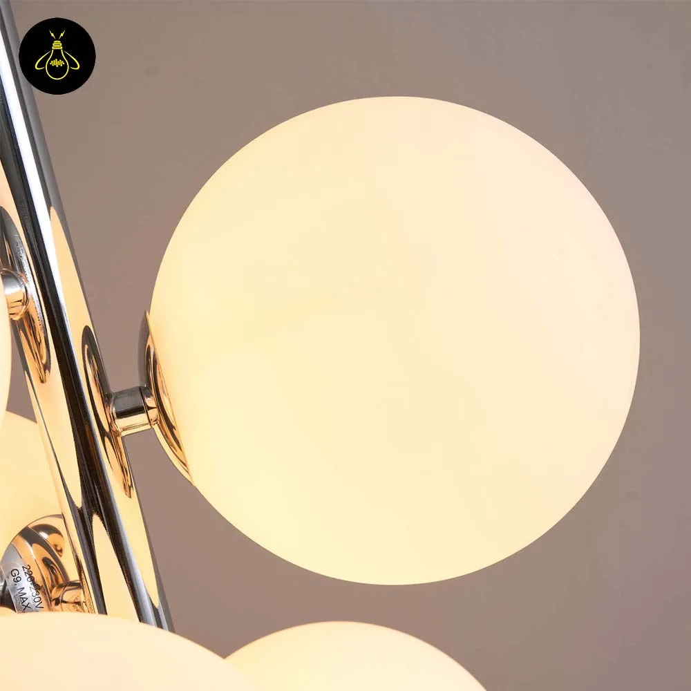 Chrome Floor Lamp with 7 White Glass Spheres – 161 cm 5 Chrome white-glass-sphere floor lamp in a hotel interior