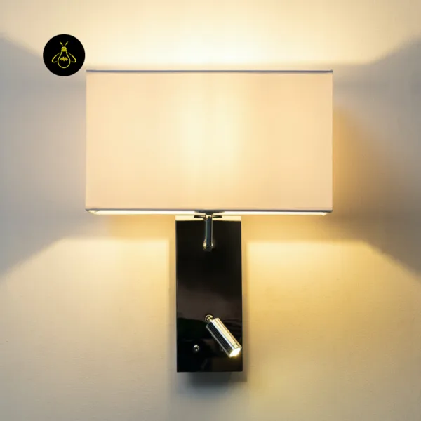 Front view of the wall mounted bedside light with the fabric shade and 1 W LED reading spot both on