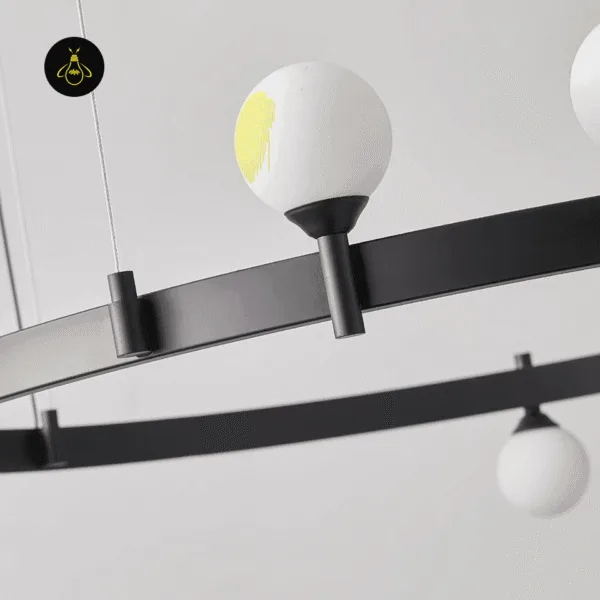 Matte black stainless steel ring and globe holders of the circle chandelier, seen from below