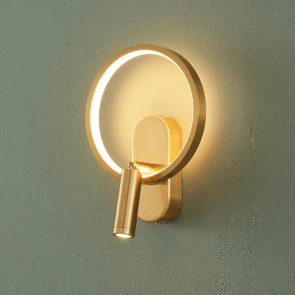 Gold circle wall light, front view of the LED ring, backplate and reading spot