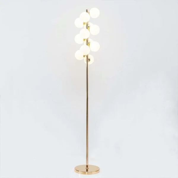 White globe floor lamp with opal-glass spheres casting soft ambient light in a modern interior