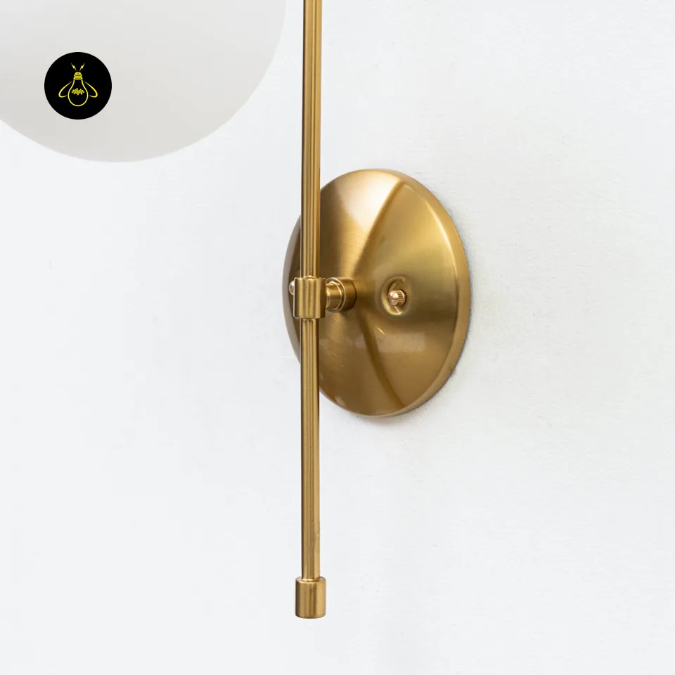 Oriol Frosted Glass Globe Wall Sconce – 48 cm Antique Gold Arch | Jagmag Lights 4 Decorative gold wall light with vintage-gold arm and white frosted globe for a guest room