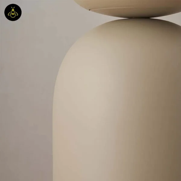 Taupe table lamp with white globe on a study desk