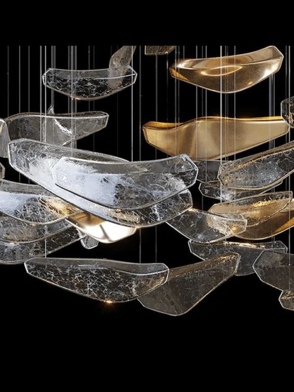 Glass jhumar detail of clear crackle glass and gold mirror-lined leaves with warm LED glow