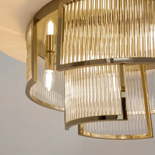 Close-up of E14 candle bulbs and fluted glass rods on the gold chandelier